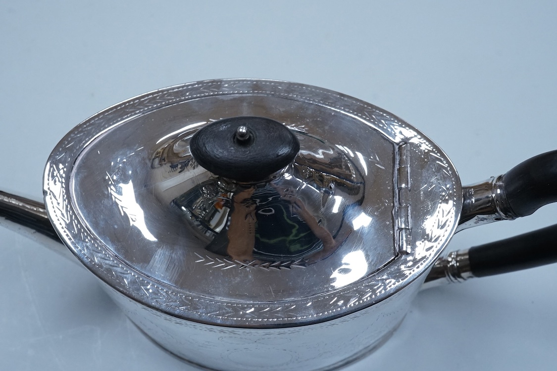 A George III engraved silver oval teapot, makers mark RD?, London, 1794, together with one other Georgian silver teapot with associated silver cover, gross weight 26.8oz.